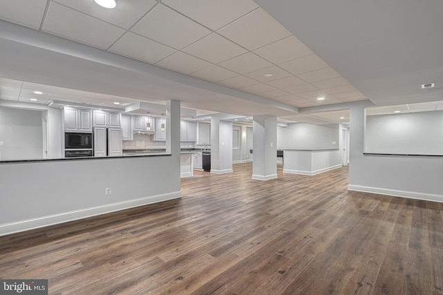 1637 Cold Bottom Rd, Sparks Glencoe, MD 21152 - unfurnished living room with baseboards, dark wood-type flooring, a paneled ceiling, and recessed lighting
