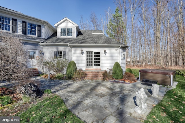 1637 Cold Bottom Rd, Sparks Glencoe, MD 21152 - back of property with a hot tub, a patio, entry steps, and brick siding