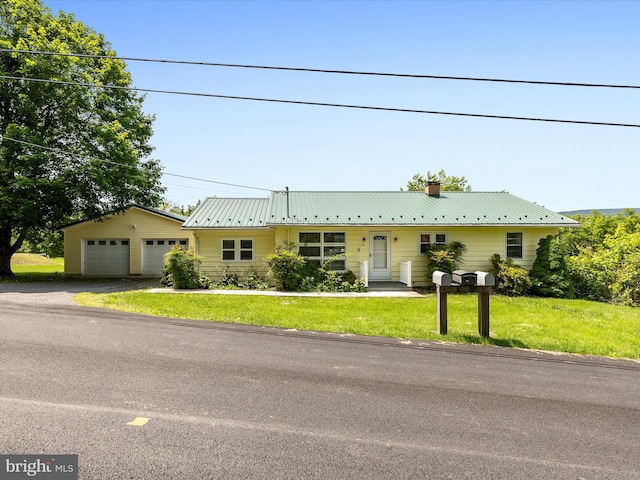 310 Bethel Rd, Paw Paw, WV 25434 - ranch-style house featuring a detached garage, a front lawn, a chimney, and metal roof