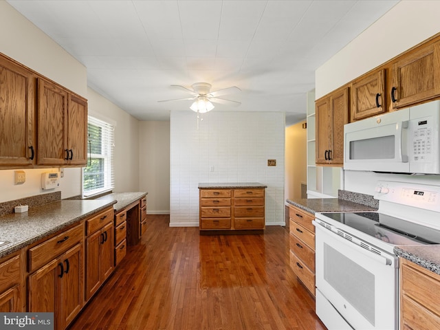 310 Bethel Rd, Paw Paw, WV 25434 - kitchen featuring white appliances, brown cabinets, ceiling fan, and dark wood-style floors