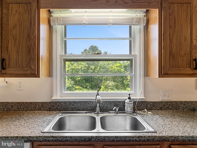 310 Bethel Rd, Paw Paw, WV 25434 - kitchen with a sink, healthy amount of natural light, brown cabinets, and dark countertops