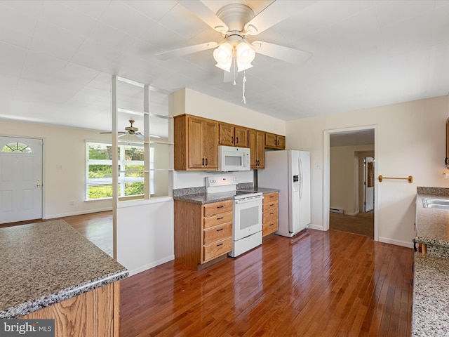 310 Bethel Rd, Paw Paw, WV 25434 - kitchen with white appliances, ceiling fan, dark wood-type flooring, brown cabinetry, and baseboards