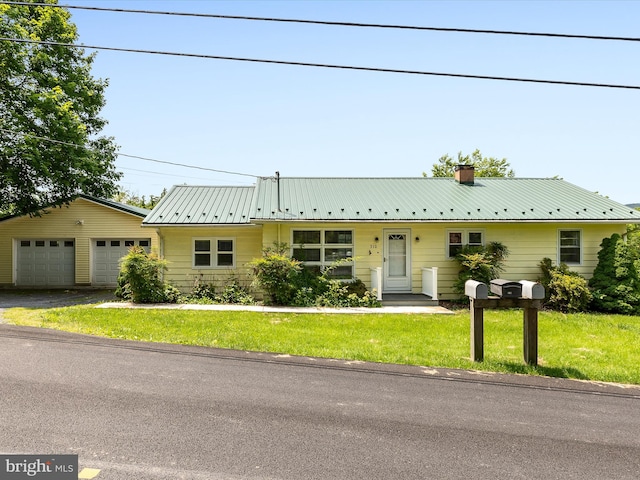 310 Bethel Rd, Paw Paw, WV 25434 - view of front of home with a chimney, a front lawn, and metal roof