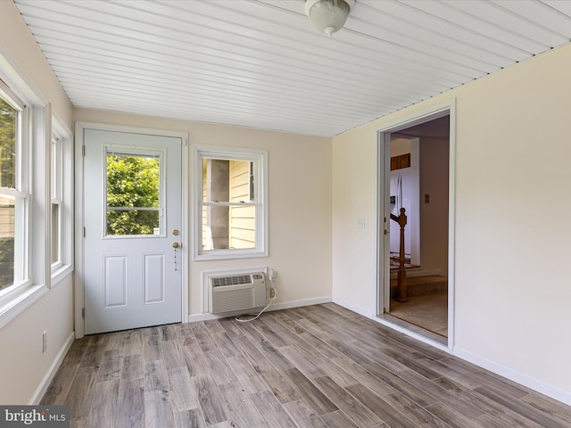 310 Bethel Rd, Paw Paw, WV 25434 - unfurnished sunroom with a wall mounted air conditioner