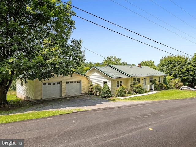 310 Bethel Rd, Paw Paw, WV 25434 - single story home with an outdoor structure, a detached garage, and central AC