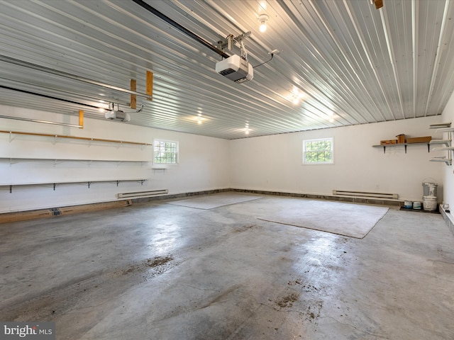 310 Bethel Rd, Paw Paw, WV 25434 - garage featuring a garage door opener and baseboard heating