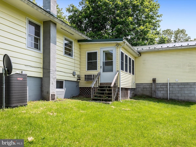 310 Bethel Rd, Paw Paw, WV 25434 - rear view of house featuring a yard, a chimney, central AC unit, and metal roof