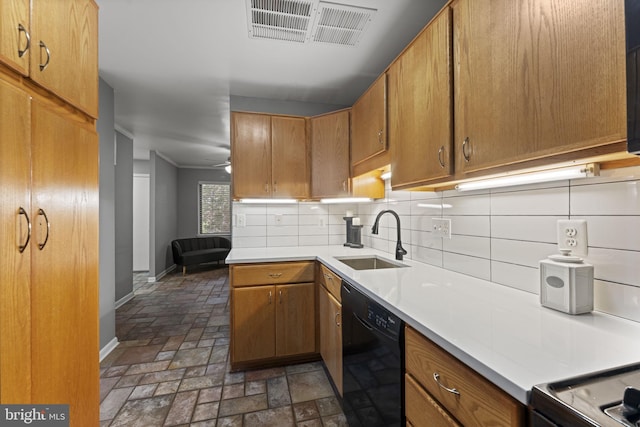 11866 S Lakes Ct, Reston, VA 20191 - kitchen with black dishwasher, backsplash, light countertops, brown cabinets, and stove