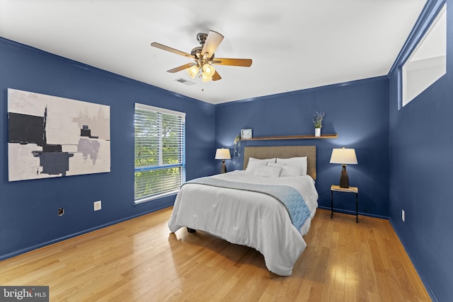 11866 S Lakes Ct, Reston, VA 20191 - bedroom featuring wood finished floors and a ceiling fan