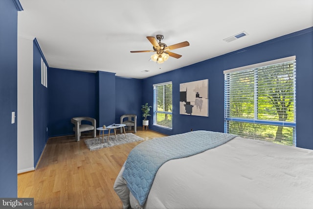 11866 S Lakes Ct, Reston, VA 20191 - bedroom featuring wood finished floors and a ceiling fan