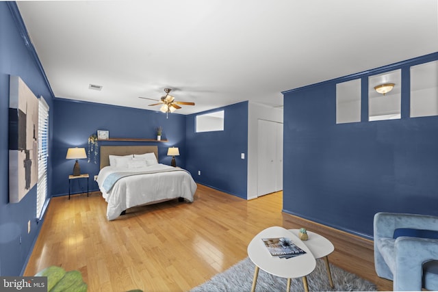 11866 S Lakes Ct, Reston, VA 20191 - bedroom featuring light wood-type flooring and ceiling fan