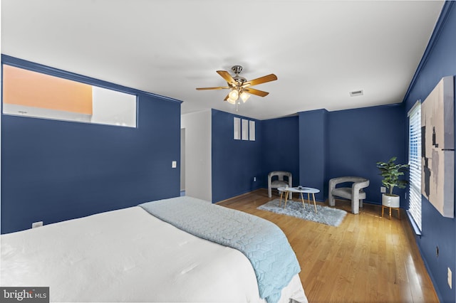 11866 S Lakes Ct, Reston, VA 20191 - bedroom with wood finished floors and ceiling fan