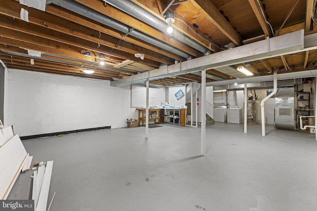 11866 S Lakes Ct, Reston, VA 20191 - unfinished basement featuring independent washer and dryer, water heater, and stairs