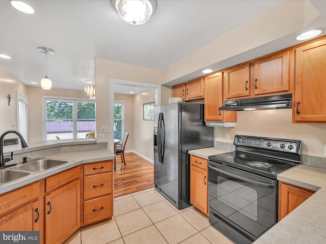 1353 Stag Dr, Auburn, PA 17922 - kitchen with black appliances, a sink, under cabinet range hood, light countertops, and recessed lighting