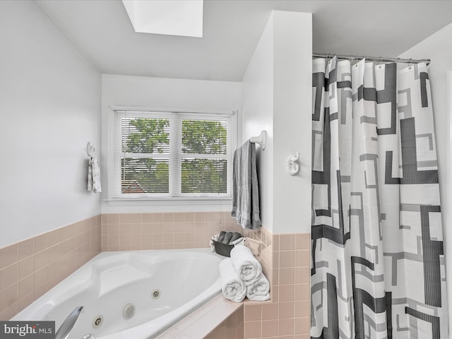 1353 Stag Dr, Auburn, PA 17922 - bathroom featuring a jetted tub, a skylight, and a shower with shower curtain