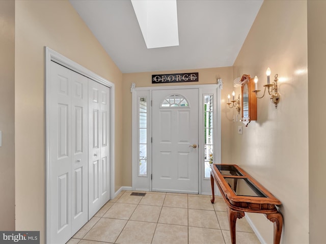 1353 Stag Dr, Auburn, PA 17922 - entryway with light tile patterned floors, a skylight, baseboards, and lofted ceiling