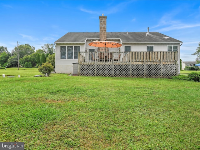 1353 Stag Dr, Auburn, PA 17922 - back of property with a wooden deck, a yard, and a chimney