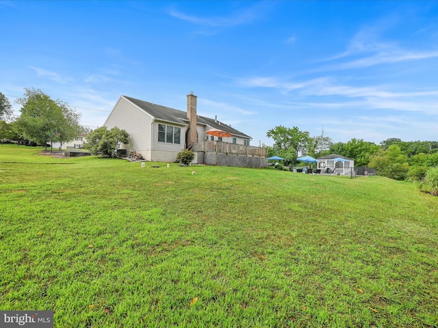 1353 Stag Dr, Auburn, PA 17922 - rear view of house featuring a chimney and a lawn