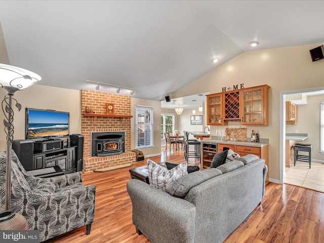 1353 Stag Dr, Auburn, PA 17922 - living area featuring light wood-type flooring, rail lighting, lofted ceiling, wine cooler, and bar area