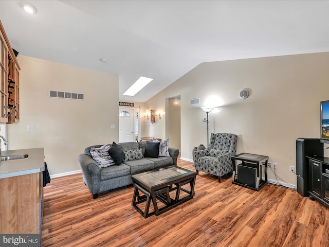1353 Stag Dr, Auburn, PA 17922 - living room with light wood-type flooring, vaulted ceiling, and baseboards
