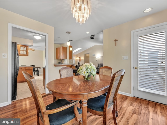 1353 Stag Dr, Auburn, PA 17922 - dining room featuring light wood-style flooring, baseboards, and a chandelier