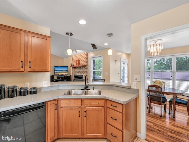 1353 Stag Dr, Auburn, PA 17922 - kitchen featuring a sink, black dishwasher, a peninsula, decorative light fixtures, and light countertops