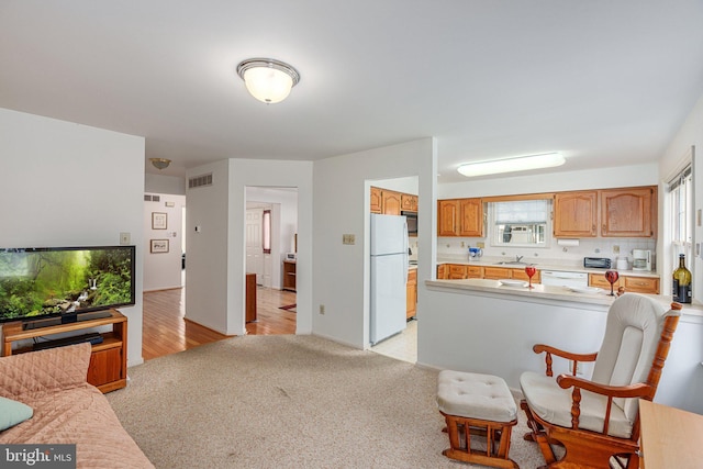 197 Victoria Ct, Doylestown, PA 18901 - kitchen with white appliances, light countertops, open floor plan, and light carpet