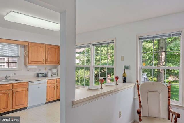 197 Victoria Ct, Doylestown, PA 18901 - kitchen featuring white dishwasher, light countertops, decorative backsplash, and light floors