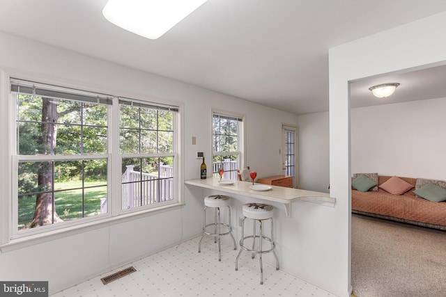 197 Victoria Ct, Doylestown, PA 18901 - kitchen with a kitchen bar, light countertops, and light floors