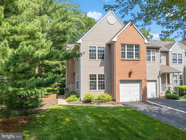 197 Victoria Ct, Doylestown, PA 18901 - view of front of property featuring asphalt driveway, brick siding, a front yard, and a garage