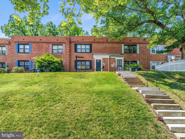 5019 Just St NE, Washington, DC 20019 - view of front of home featuring stairway, a front yard, and brick siding