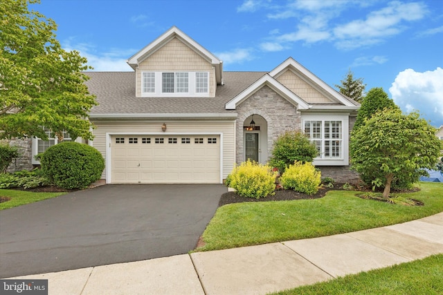151 Lattice Ln, Collegeville, PA 19426 - craftsman house with asphalt driveway, stone siding, a garage, a front yard, and a shingled roof