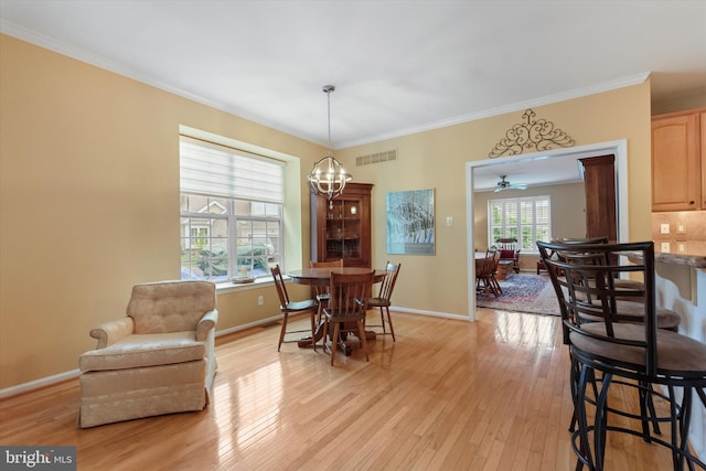 151 Lattice Ln, Collegeville, PA 19426 - dining space featuring light wood-style flooring, crown molding, and a chandelier