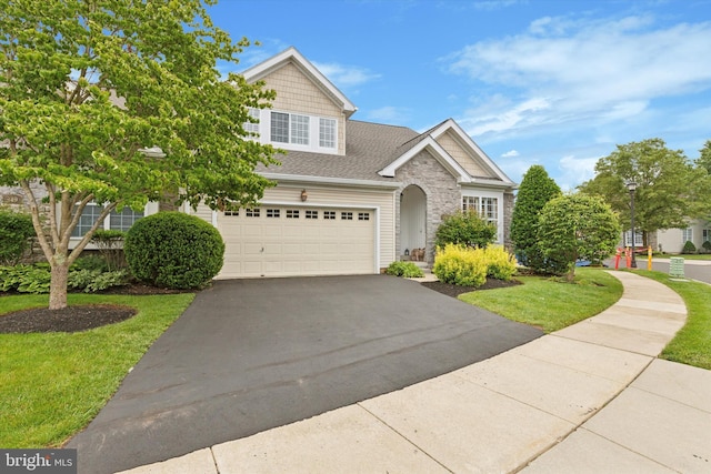 151 Lattice Ln, Collegeville, PA 19426 - view of front of house featuring asphalt driveway, a front lawn, an attached garage, a shingled roof, and stone siding