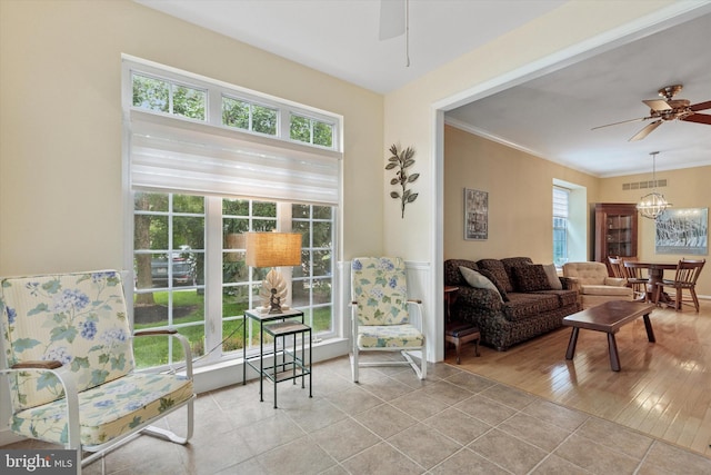 151 Lattice Ln, Collegeville, PA 19426 - living area featuring a ceiling fan, light tile patterned flooring, a chandelier, and crown molding