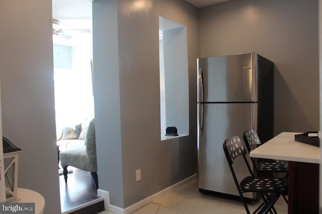 5923 N Broad St, Philadelphia, PA 19141 - kitchen with freestanding refrigerator, baseboards, a ceiling fan, and light countertops
