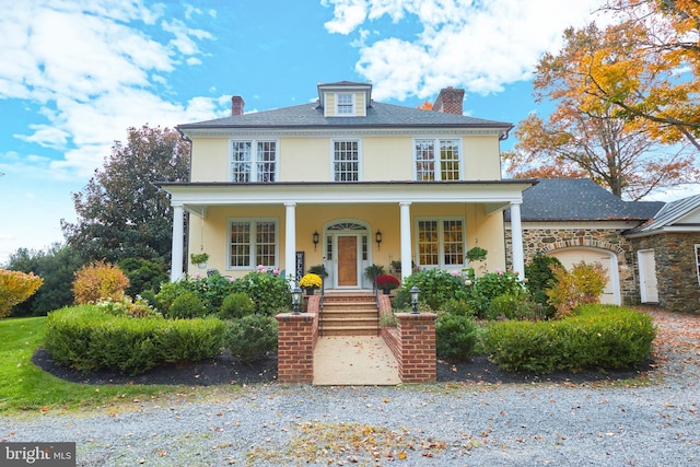 35175 Snickersville Tpke, Round Hill, VA 20141 - traditional style home with stucco siding, a chimney, and covered porch