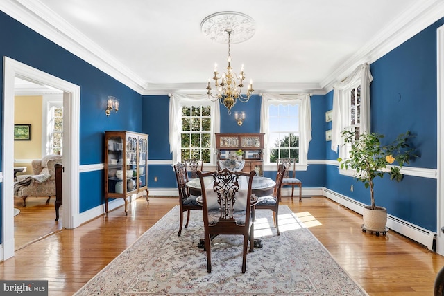 35175 Snickersville Tpke, Round Hill, VA 20141 - dining room with a chandelier, hardwood / wood-style floors, crown molding, baseboard heating, and a baseboard heating unit