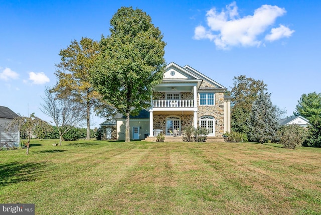 35175 Snickersville Tpke, Round Hill, VA 20141 - greek revival house featuring a balcony, ceiling fan, stone siding, and a front yard