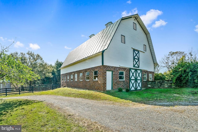 35175 Snickersville Tpke, Round Hill, VA 20141 - view of side of home featuring a barn, brick siding, an outbuilding, a gambrel roof, and metal roof