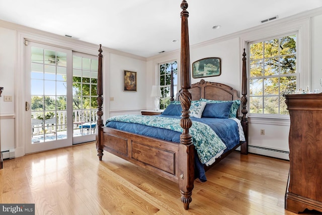 35175 Snickersville Tpke, Round Hill, VA 20141 - bedroom with baseboard heating, access to outside, multiple windows, and crown molding