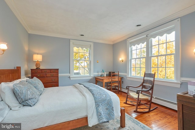 35175 Snickersville Tpke, Round Hill, VA 20141 - bedroom featuring wood finished floors, a baseboard radiator, and crown molding