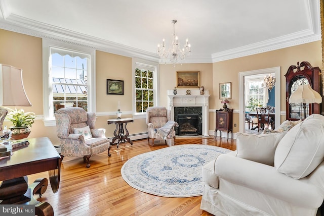 35175 Snickersville Tpke, Round Hill, VA 20141 - living room featuring ornamental molding, healthy amount of natural light, a chandelier, and light wood-style floors