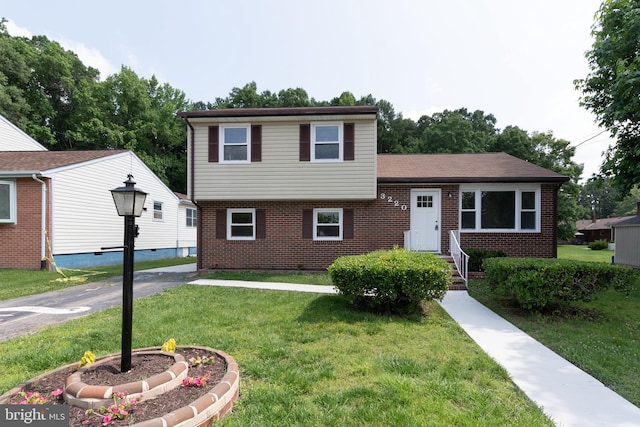 3220 Dupuy Rd, Colonial Heights, VA 23834 - split level home featuring brick siding and a front lawn