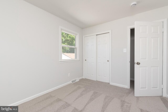 3220 Dupuy Rd, Colonial Heights, VA 23834 - unfurnished bedroom featuring carpet flooring, baseboards, and a closet