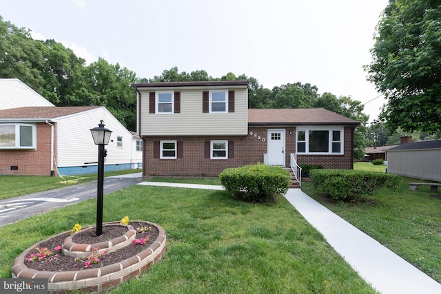 3220 Dupuy Rd, Colonial Heights, VA 23834 - tri-level home with brick siding and a front lawn