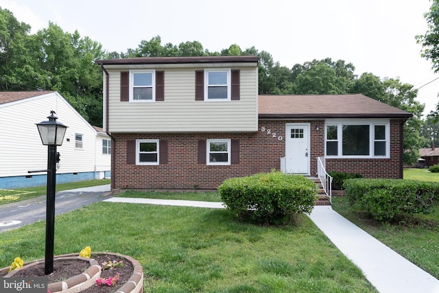 3220 Dupuy Rd, Colonial Heights, VA 23834 - tri-level home with brick siding and a front yard