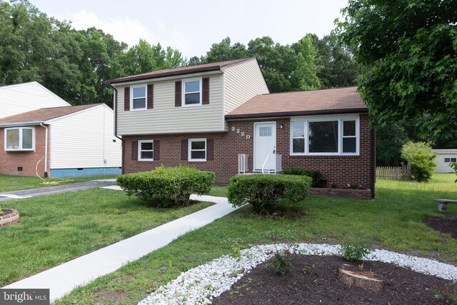 3220 Dupuy Rd, Colonial Heights, VA 23834 - tri-level home with brick siding and a front yard