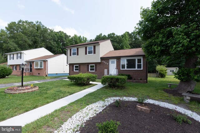3220 Dupuy Rd, Colonial Heights, VA 23834 - tri-level home with brick siding and a front lawn
