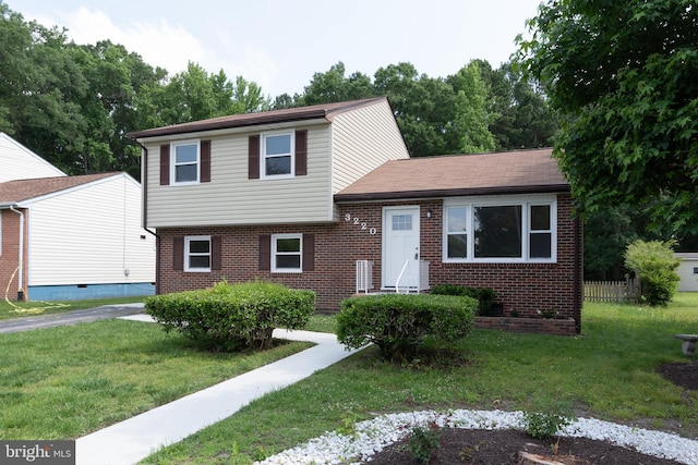 3220 Dupuy Rd, Colonial Heights, VA 23834 - split level home featuring brick siding and a front lawn